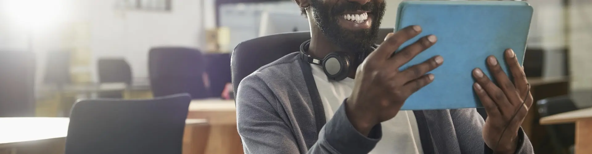 Student in classroom looking at a tablet