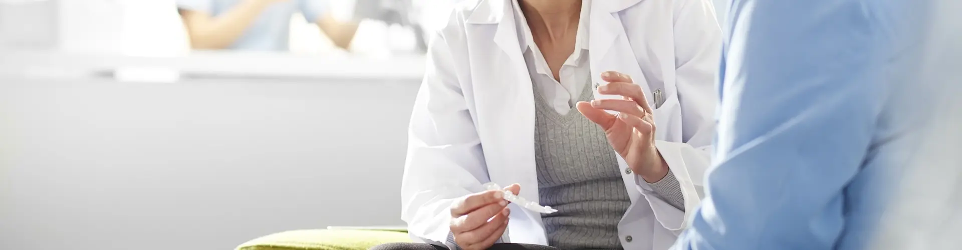 Pharmacist talking to a customer