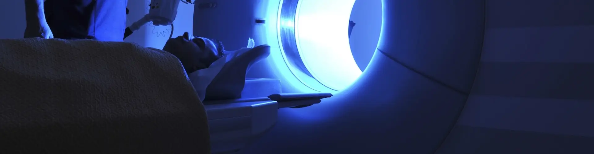 Radiographer with MRI machine