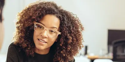 A Functional Assessor sitting at a desk and discussing