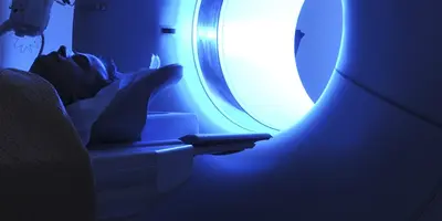 Radiographer with MRI machine