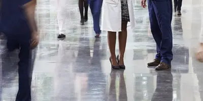 Blurred group of healthcare professionals in a hospital corridor